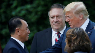North Korean envoy Kim Yong Chol talks with U.S. President Donald Trump as Secretary of State Mike Pompeo looks on after a meeting at the White House in Washington, U.S., June 1, 2018. REUTERS/Leah Millis