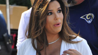 A very pregnant Eva Longoria displays her baby bump on Extra TV at Universal Studios in Hollywood