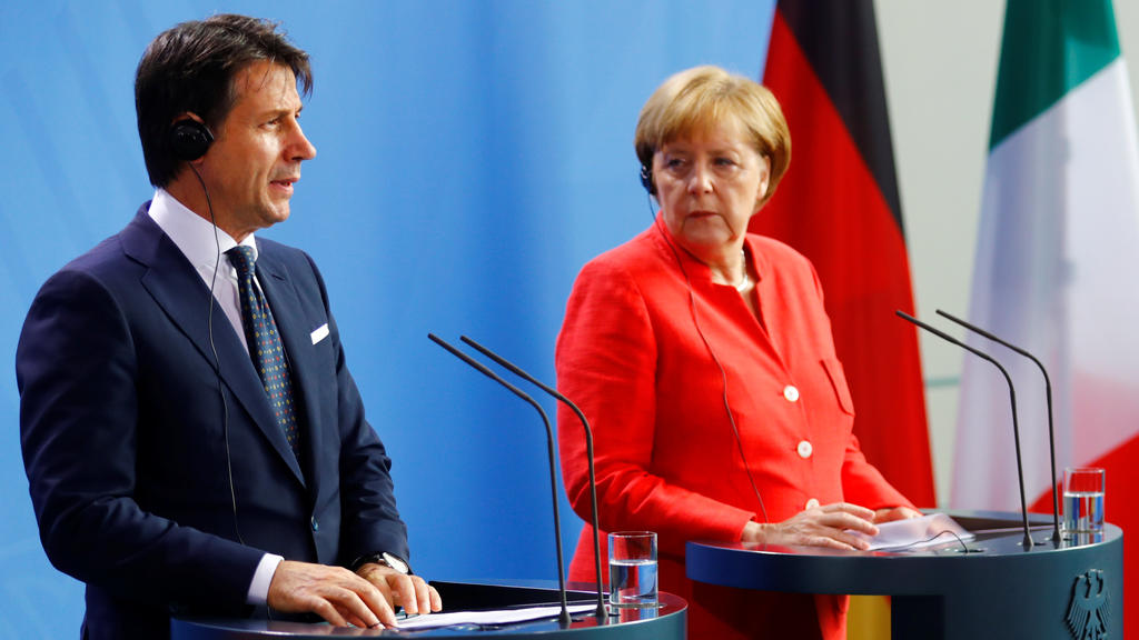German Chancellor Angela Merkel and Italian Prime Minister Giuseppe Conte hold a news conference at the chancellery in Berlin, Germany, June 18, 2018. REUTERS/Hannibal Hanschke