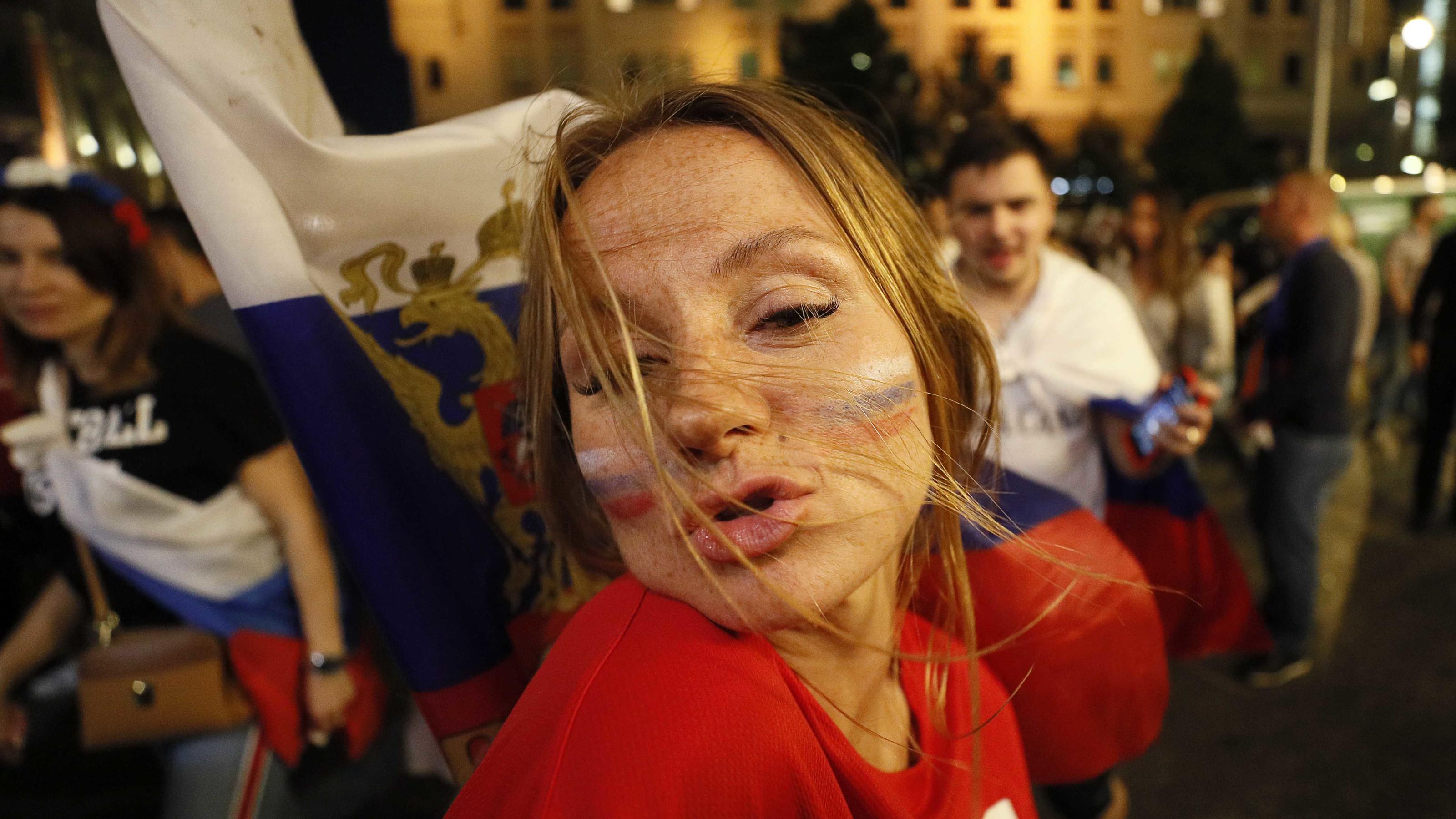Soccer Football - World Cup - Round of 16 - Spain vs Russia - Moscow, Russia - July 1, 2018. Russian supporters celebrate the victory in the city centre. REUTERS/Gleb Garanich