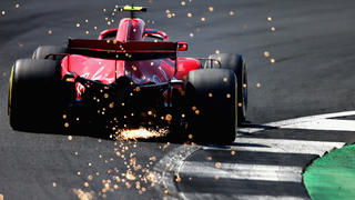 NORTHAMPTON, ENGLAND - JULY 07: Sparks fly behind Kimi Raikkonen of Finland driving the (7) Scuderia Ferrari SF71H on track during final practice for the Formula One Grand Prix of Great Britain at Silverstone on July 7, 2018 in Northampton, England.  (Photo by Charles Coates/Getty Images)