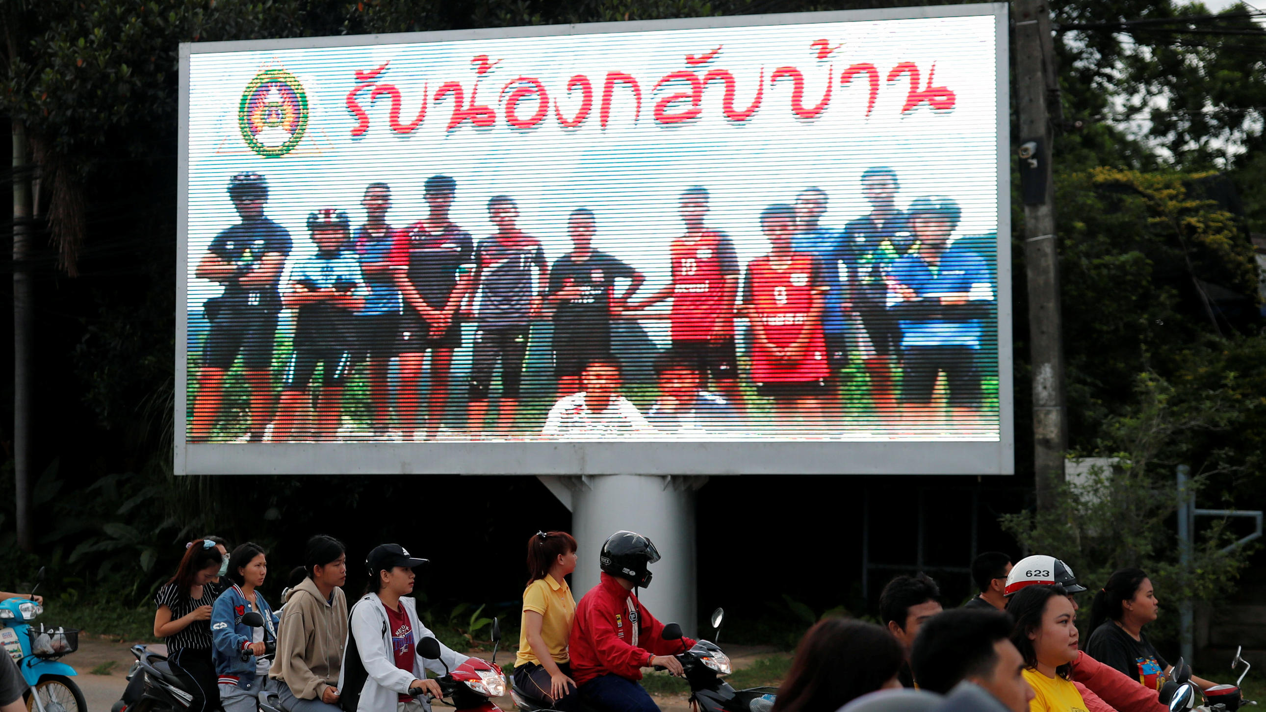 A board showing "Welcome home, boys", is seen after rescue effort has begun for the 12 schoolboys and their soccer coach trapped in Tham Luang cave, in Chiang Rai, Thailand, July 9, 2018. REUTERS/Tyrone Siu
