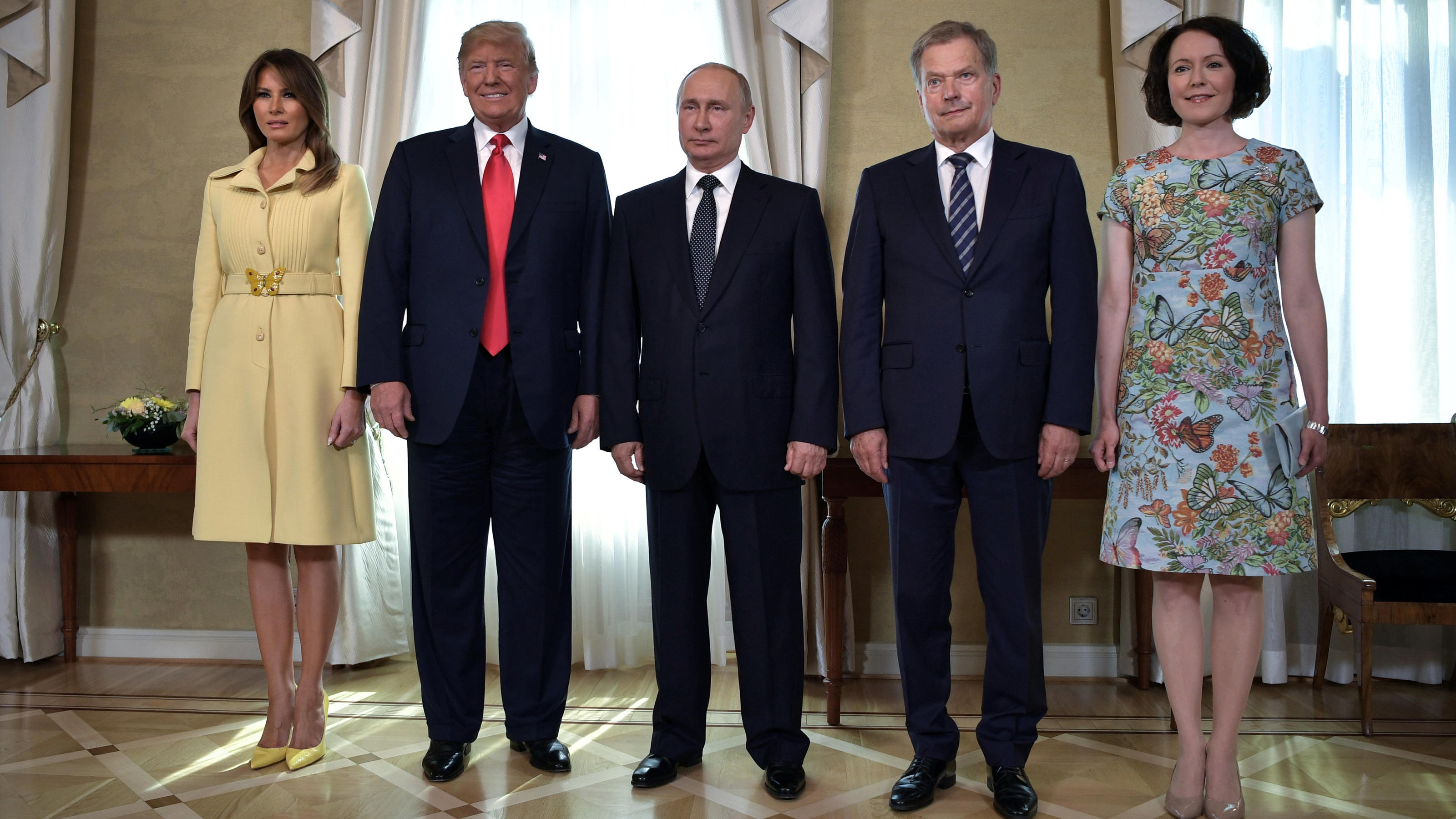 Russia's President Vladimir Putin (C), U.S. President Donald Trump (2nd L), First lady Melania Trump (L), Finland's President Sauli Niinisto (2nd R) and his wife Jenni Haukio apose for a picture during a meeting in Helsinki, Finland July 16, 2018. Sp