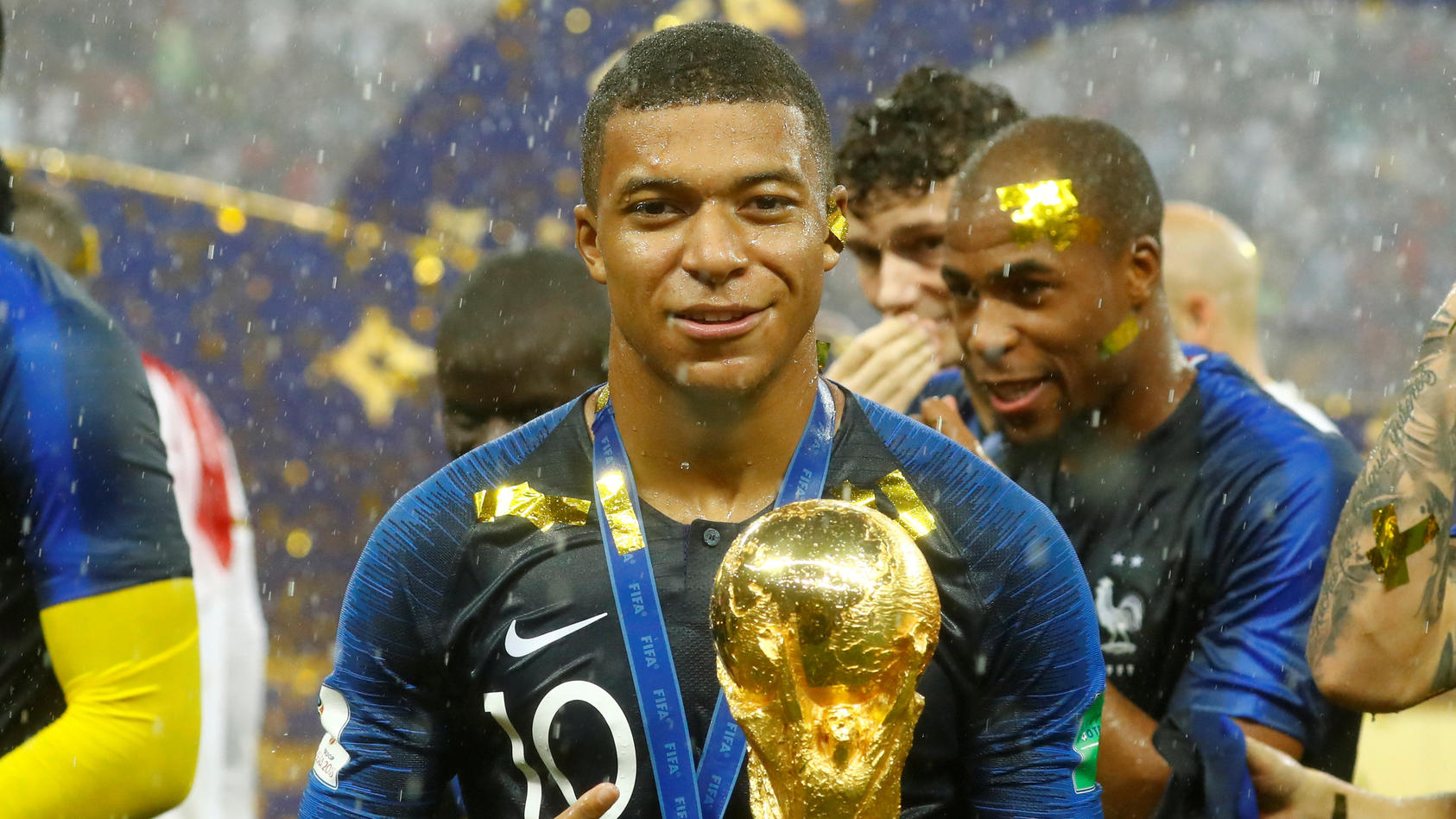 Soccer Football - World Cup - Final - France v Croatia - Luzhniki Stadium, Moscow, Russia - July 15, 2018  France's Kylian Mbappe celebrates with the trophy after winning the World Cup  REUTERS/Kai Pfaffenbach