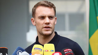 FRANKFURT AM MAIN, GERMANY - JUNE 28:  Manuel Neuer talks to the media during the return of the German national football team from the FIFA World Cup Russia 2018 at Frankfurt International Airport on June 28, 2018 in Frankfurt am Main, Germany.  (Photo by Alex Grimm/Bongarts/Getty Images)