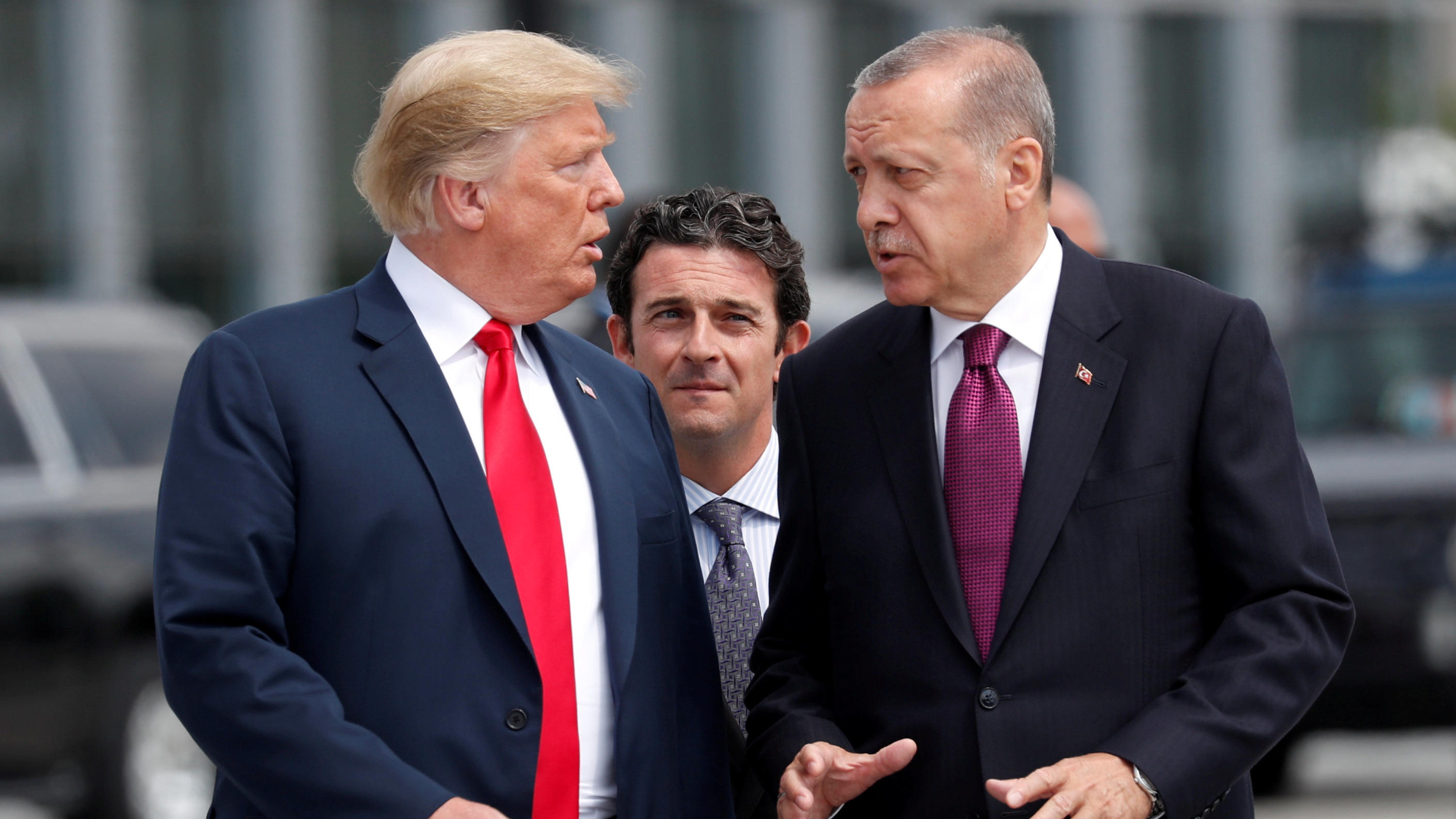 FILE PHOTO: U.S. President Donald Trump and Turkish President Tayyip Erdogan gesture as they talk at the start of the NATO summit in Brussels, Belgium July 11, 2018.  REUTERS/Kevin Lamarque/File Photo