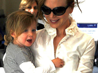 Birthday girl Nicole Kidman and  daughter Sunday Rose greet Keith Urban at LAX on Father's Day.
