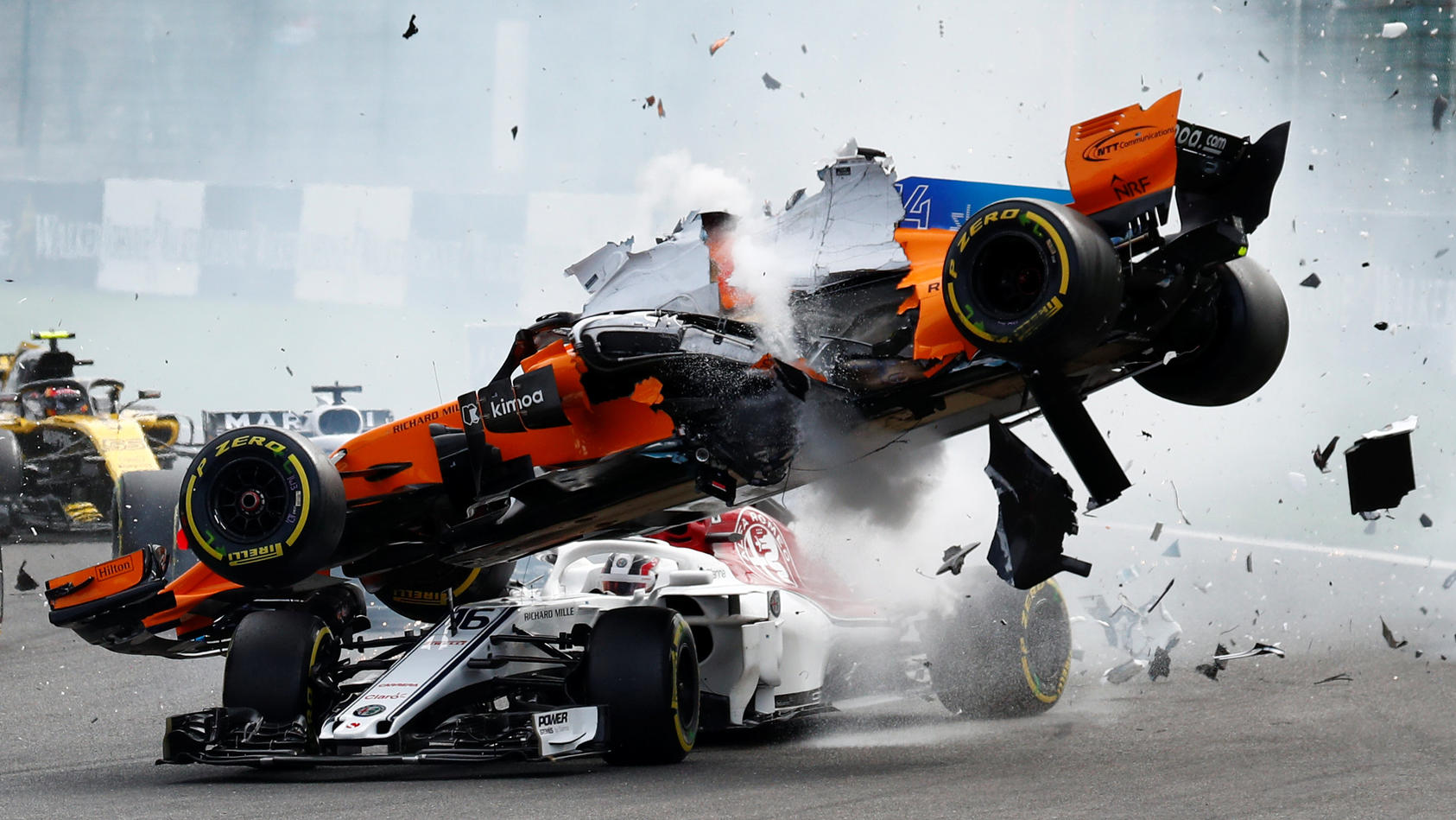 Formula One F1 - Belgian Grand Prix - Spa-Francorchamps, Stavelot, Belgium - August 26, 2018  McLaren's Fernando Alonso and Sauber's Charles Leclerc crash at the first corner  REUTERS/Francois Lenoir
