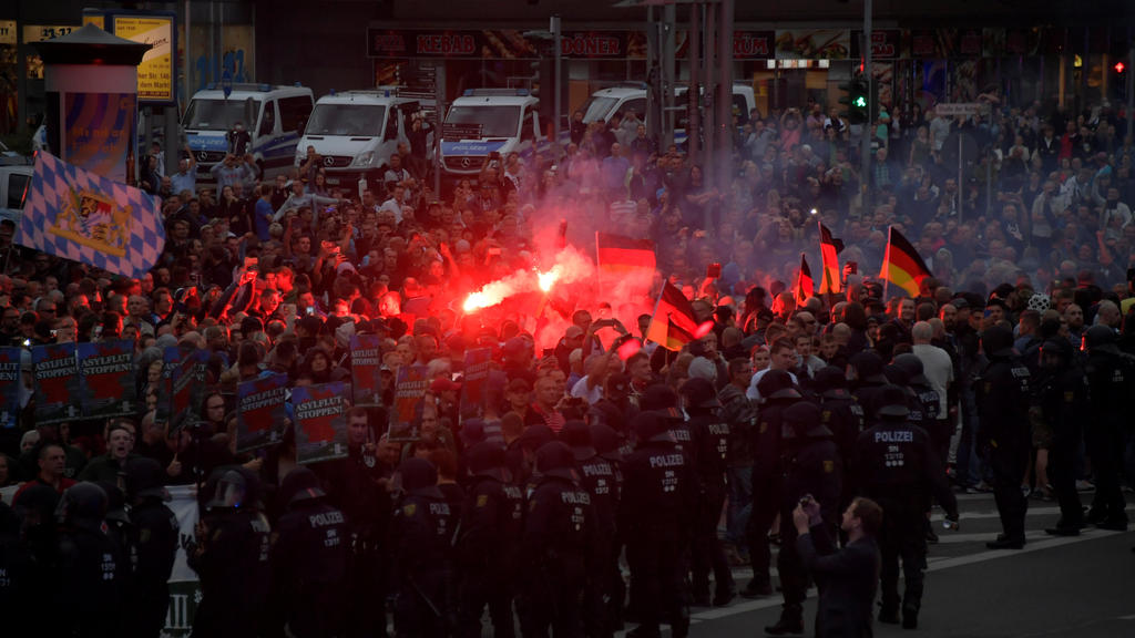 Right-wing supporters protest after a German man was stabbed last weekend in Chemnitz, Germany, August 27, 2018. REUTERS/Matthias Rietschel