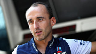 MONZA, ITALY - AUGUST 30:  Robert Kubica of Poland and Williams talks on the pit wall during previews ahead of the Formula One Grand Prix of Italy at Autodromo di Monza on August 30, 2018 in Monza, Italy.  (Photo by Mark Thompson/Getty Images)