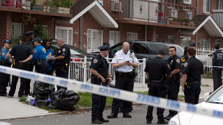 Police gather outside a daycare center in a private home, after a stabbing in the Queens borough of New York, U.S., September 21, 2018.   REUTERS/Lloyd Mitchell