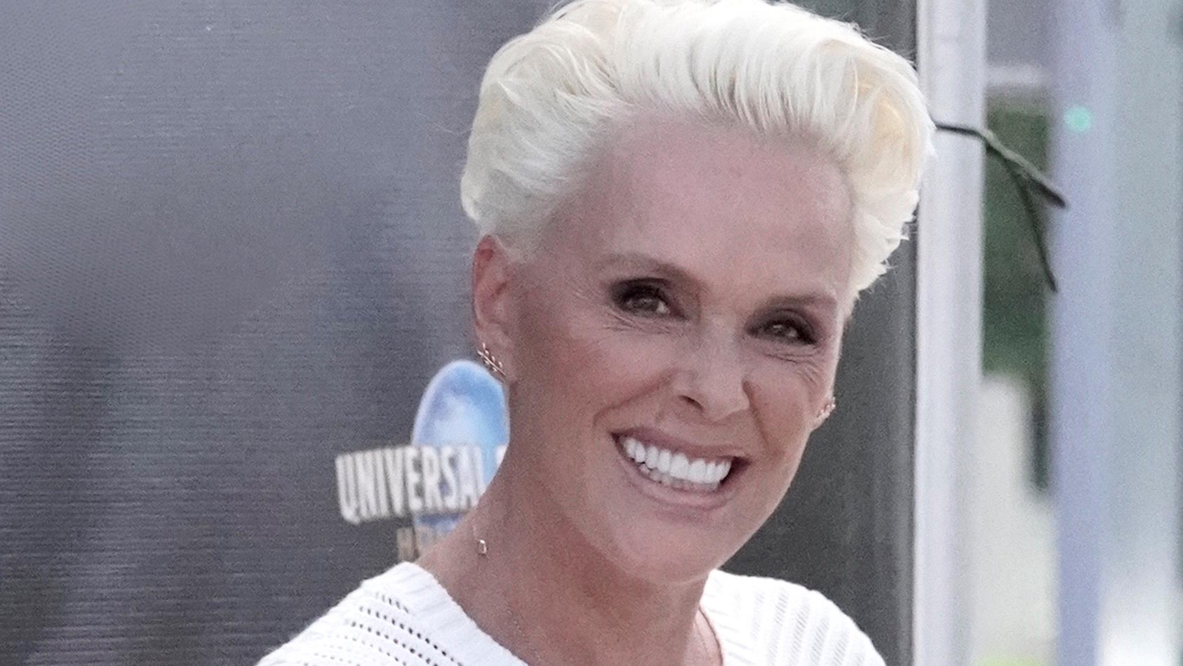 EXCLUSIVE: Actress Brigitte Nielsen and her husband Mattia Dessi are seen filming EXTRA TV Live in Los Angeles. After filming they fooled around together in the parking lot taking pictures of each other.Pictured: Brigitte NielsenRef: SPL5023203 11091