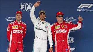 Oct 20, 2018; Austin, TX, USA; Ferrari driver Sebastian Vettel of Germany (left) and Mercedes driver Lewis Hamilton of Great Britain (center and Ferrari driver Kimi Raikkonen (7) of Finland wave to the crowd after Hamilton takes the pole position during qualifying for the Unites States Grand Prix at Circuit of the Americas. Mandatory Credit: Jerome Miron-USA TODAY Sports