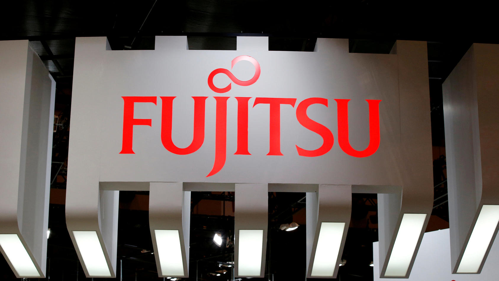 FILE PHOTO: A Fujitsu logo pictured at CEATEC (Combined Exhibition of Advanced Technologies) JAPAN 2016 at the Makuhari Messe in Chiba, Japan, October 3, 2016.   REUTERS/Toru Hanai//File Photo