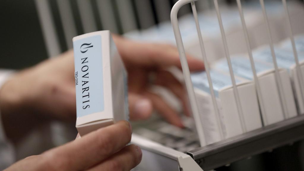 A Novartis-labeled box is cataloged prior to testing procedures Tuesday, Aug. 14, 2018 at Banner Alzheimers Institute in Phoenix. Novartis and Amgen are making of two experimental drugs being tested to try to prevent Alzheimers while memory and think