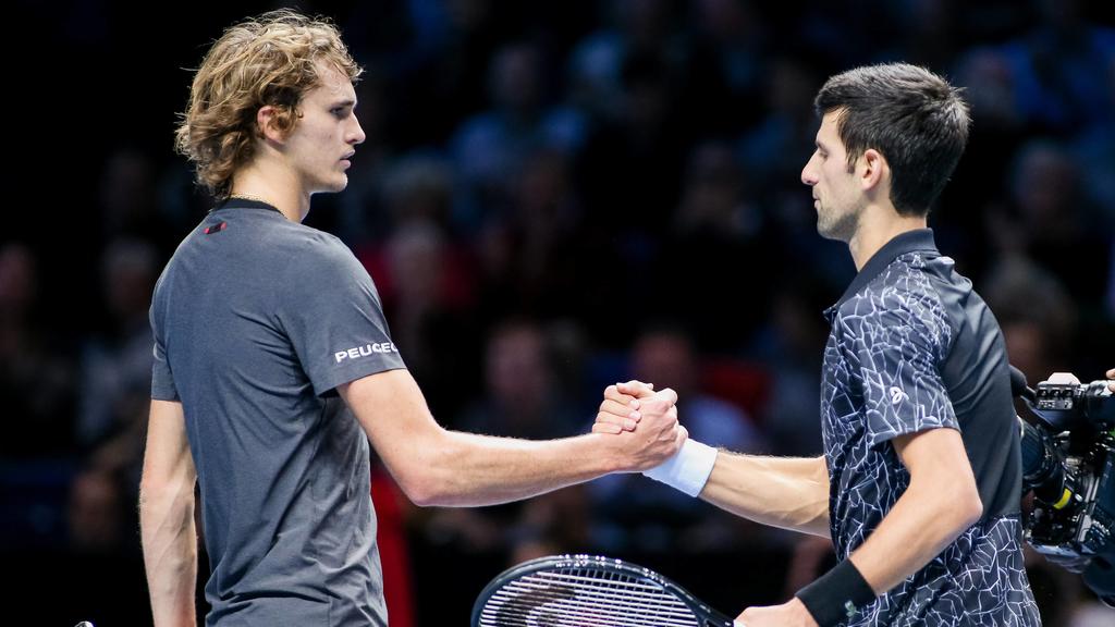 Novak Djokovic of Serbia and Alexander Zverev of Germany greet each other after the men s singles match of the 2018 Nitto ATP Tennis Herren Finals at the O2 Arena in London, England on November 14, 2018. PUBLICATIONxINxGERxSUIxAUTxHUNxONLY (20181114_