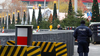 A police officer walks beside security barrier next to the site of the Christmas market's truck attack, which killed 12 people and injured many others two years ago, at Breitscheidplatz square in Berlin, Germany, November 22, 2018. REUTERS/Fabrizio Bensch