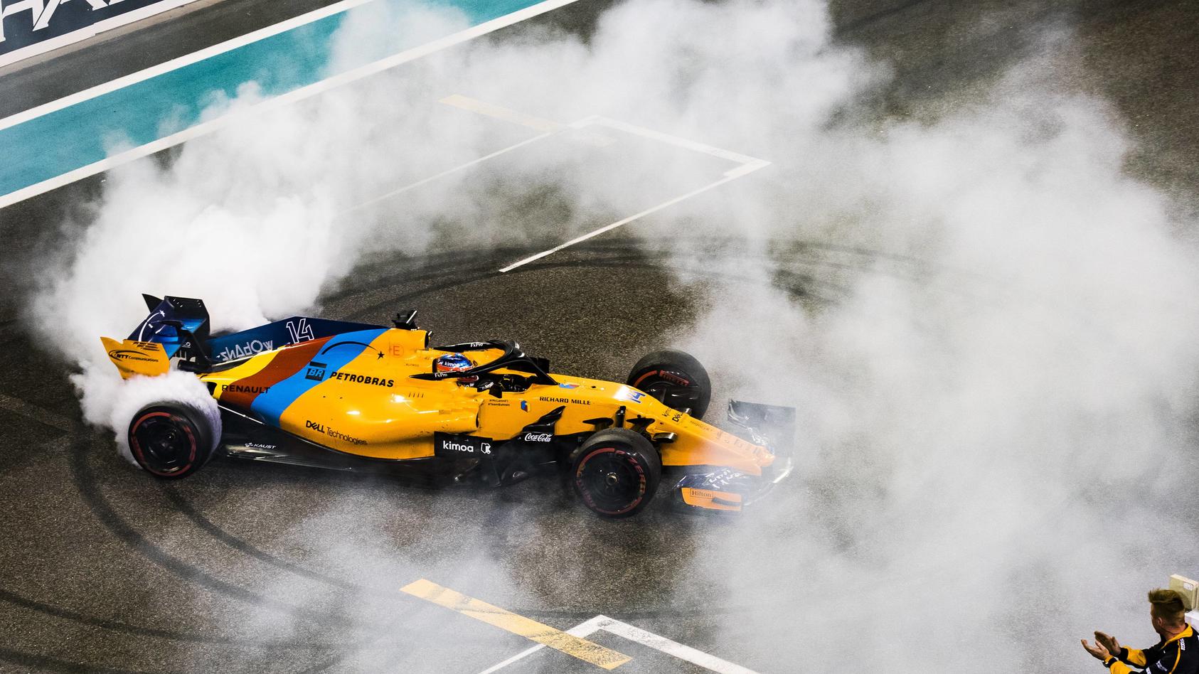 2018 Abu Dhabi GP YAS MARINA CIRCUIT, UNITED ARAB EMIRATES - NOVEMBER 25: Fernando Alonso, McLaren MCL33, performs donuts on the grid at the end of the race during the Abu Dhabi GP at Yas Marina Circuit on November 25, 2018 in Yas Marina Circuit, Uni
