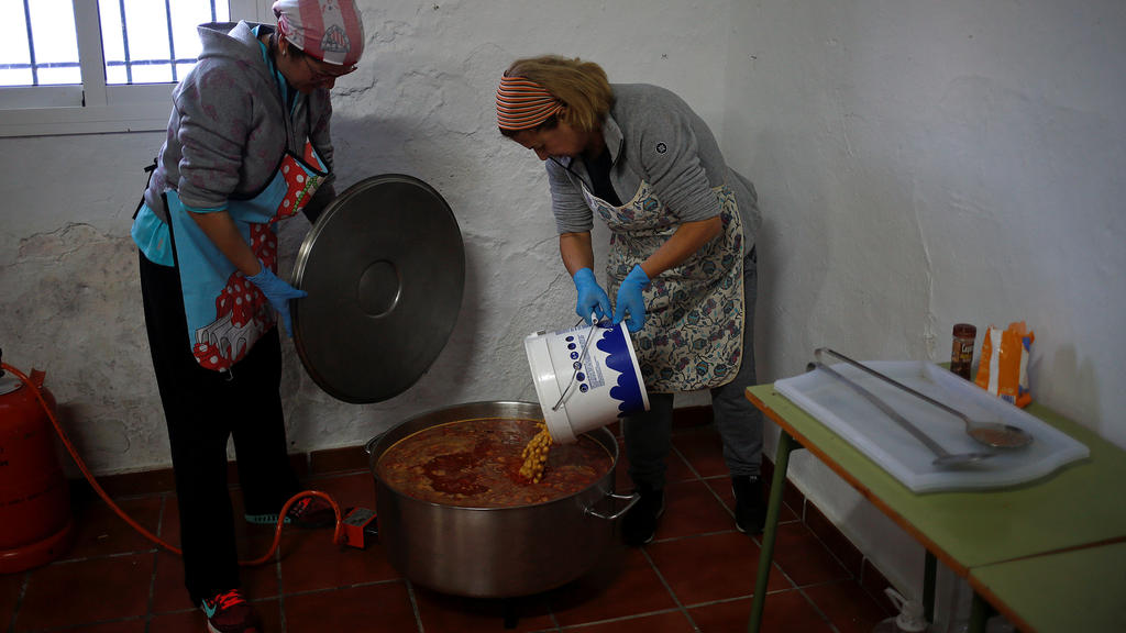 Volunteers cook food for the rescue personnel at the area where Julen, a Spanish two-year-old boy, fell into a deep well eight days ago when the family was taking a stroll through a private estate, in Totalan, southern Spain January 21, 2019. REUTERS