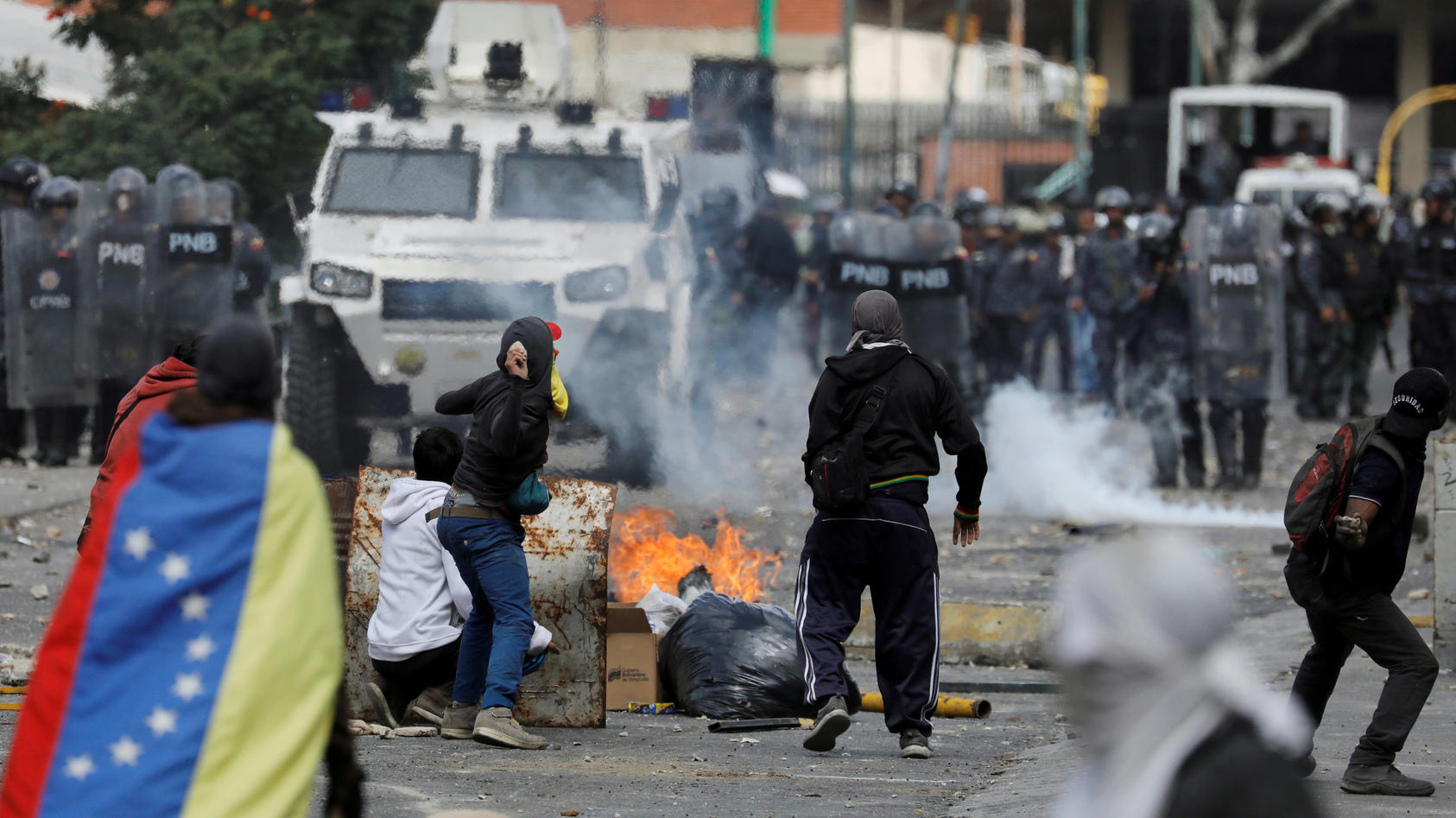 FILE PHOTO: Demonstrators clash with police during a protest against Venezuelan President Nicolas Maduro's government in Caracas, Venezuela January 23, 2019. REUTERS/Manaure Quintero/File Photo