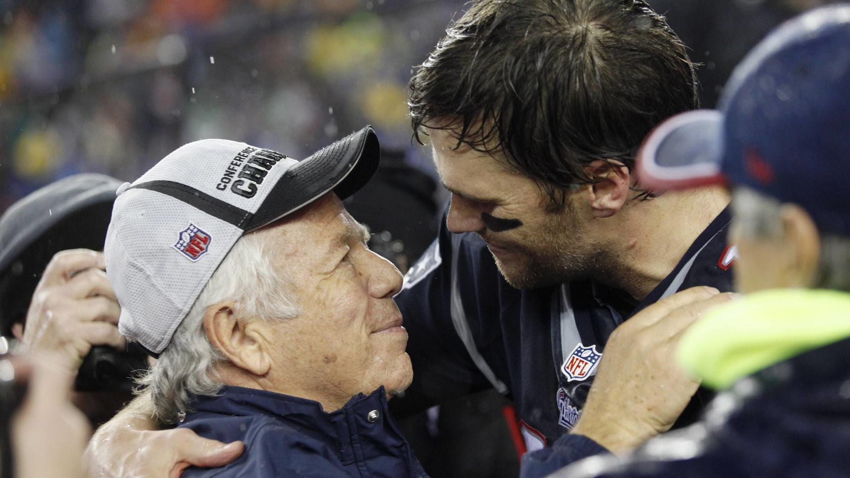 New England Patriots quarterback Tom Brady 12 hugs Patriots owner Robert Kraft after the team def