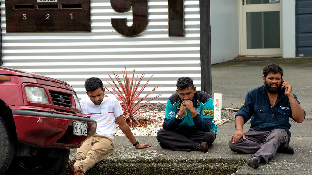 Grieving members of the public following a shooting at the Al Noor mosque in Christchurch, New Zealand, March 15, 2019. REUTERS/SNPA/Martin Hunter  ATTENTION EDITORS - NO RESALES. NO ARCHIVES     TPX IMAGES OF THE DAY