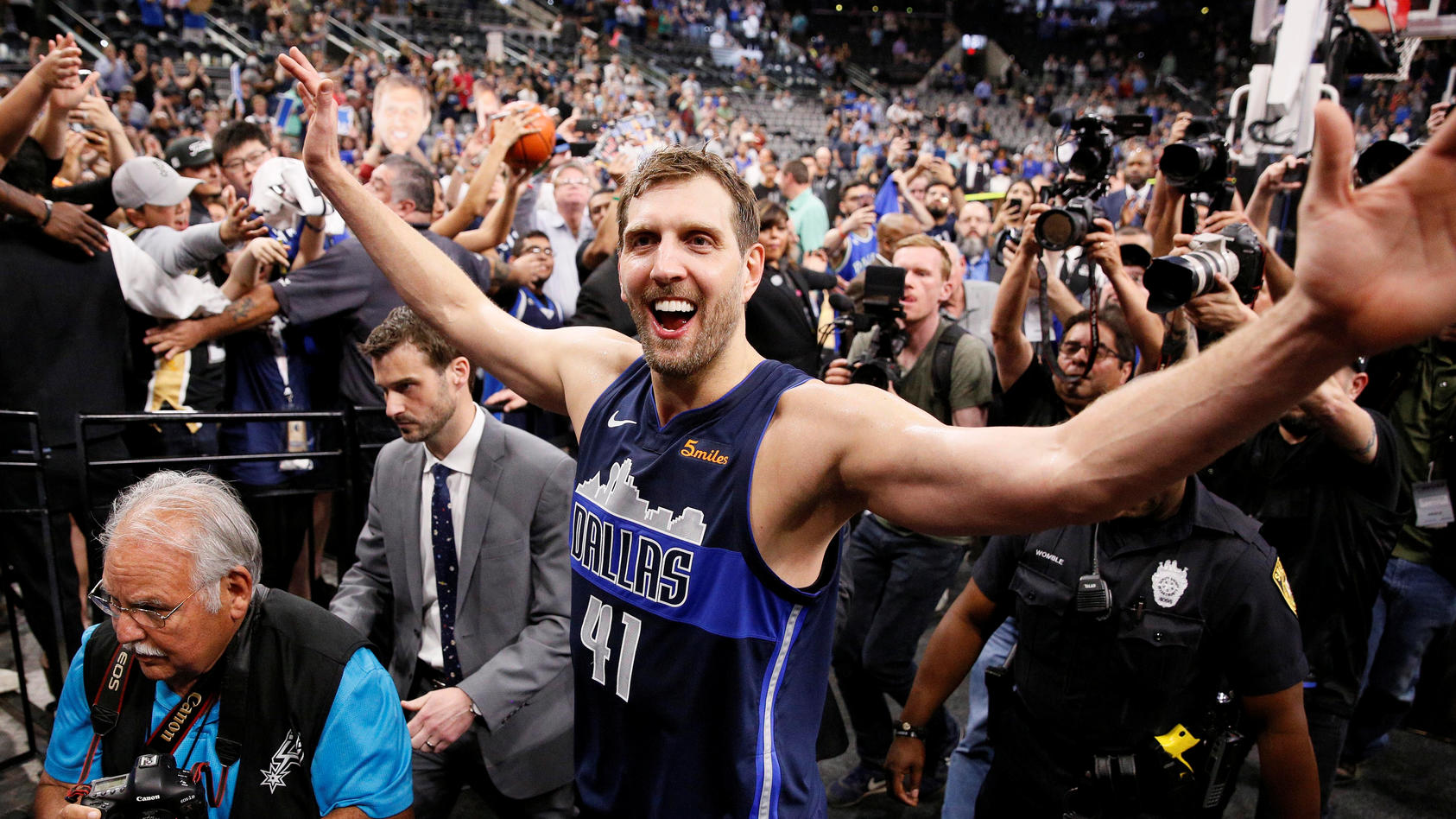 FILE PHOTO: Apr 10, 2019; San Antonio, TX, USA; Dallas Mavericks power forward Dirk Nowitzki (41) high fives the fans while leaving the court after the game against the San Antonio Spurs at AT&T Center. Mandatory Credit: Soobum Im-USA TODAY Sports/Fi