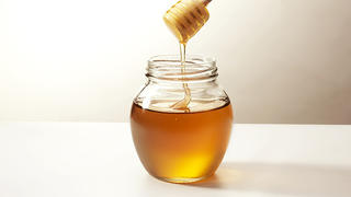 Warm honey in a stick