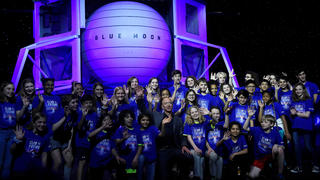 Founder, Chairman, CEO and President of Amazon Jeff Bezos poses with children from 'Club of the Future' after his space company Blue Origin's space exploration lunar lander rocket called Blue Moon was unveiled at an event in Washington, U.S., May 9, 2019. REUTERS/Clodagh Kilcoyne