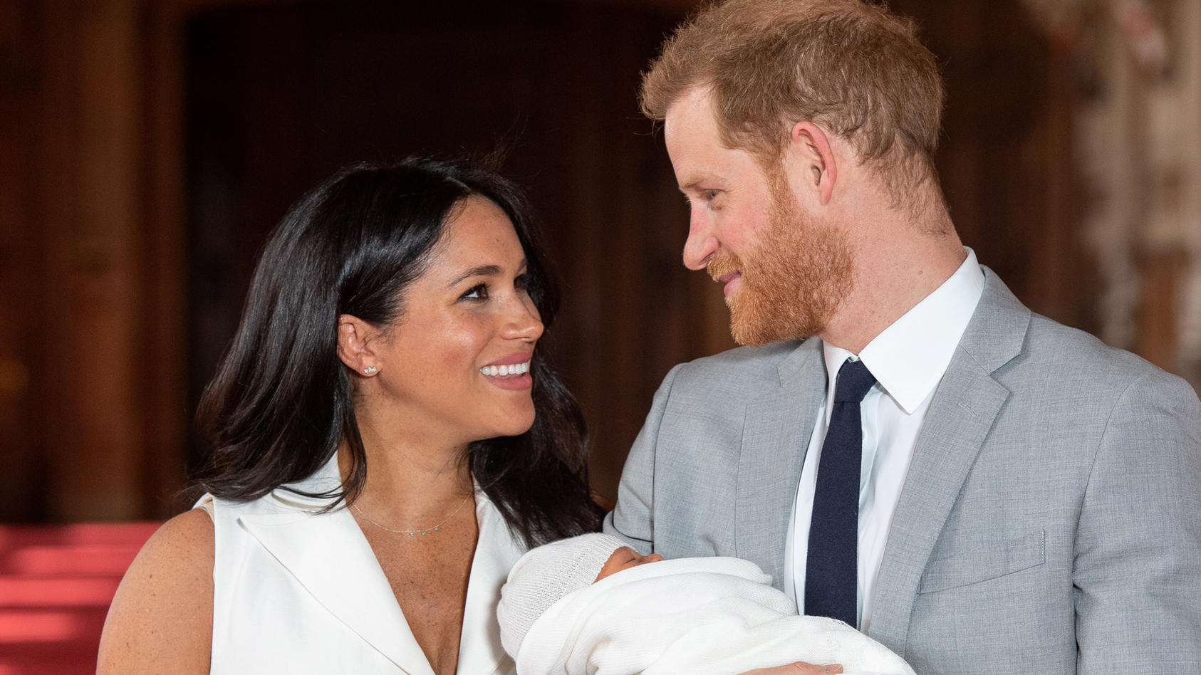 Britain's Prince Harry and Meghan, Duchess of Sussex hold their baby son, who was born on Monday morning, during a photocall in St George's Hall at Windsor Castle, in Berkshire, Britain May 8, 2019. Dominic Lipinski/Pool via REUTERS