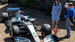 Harry looks at the F1 car which he received from Lewis Hamilton, in Redhill, Surrey, Britain May 13, 2019 in this image taken from social media on May 14, 2019.  James Shaw/ via REUTERS ATTENTION EDITORS - THIS IMAGE WAS PROVIDED BY A THIRD PARTY. NO RESALES. NO ARCHIVES. MANDATORY CREDIT.