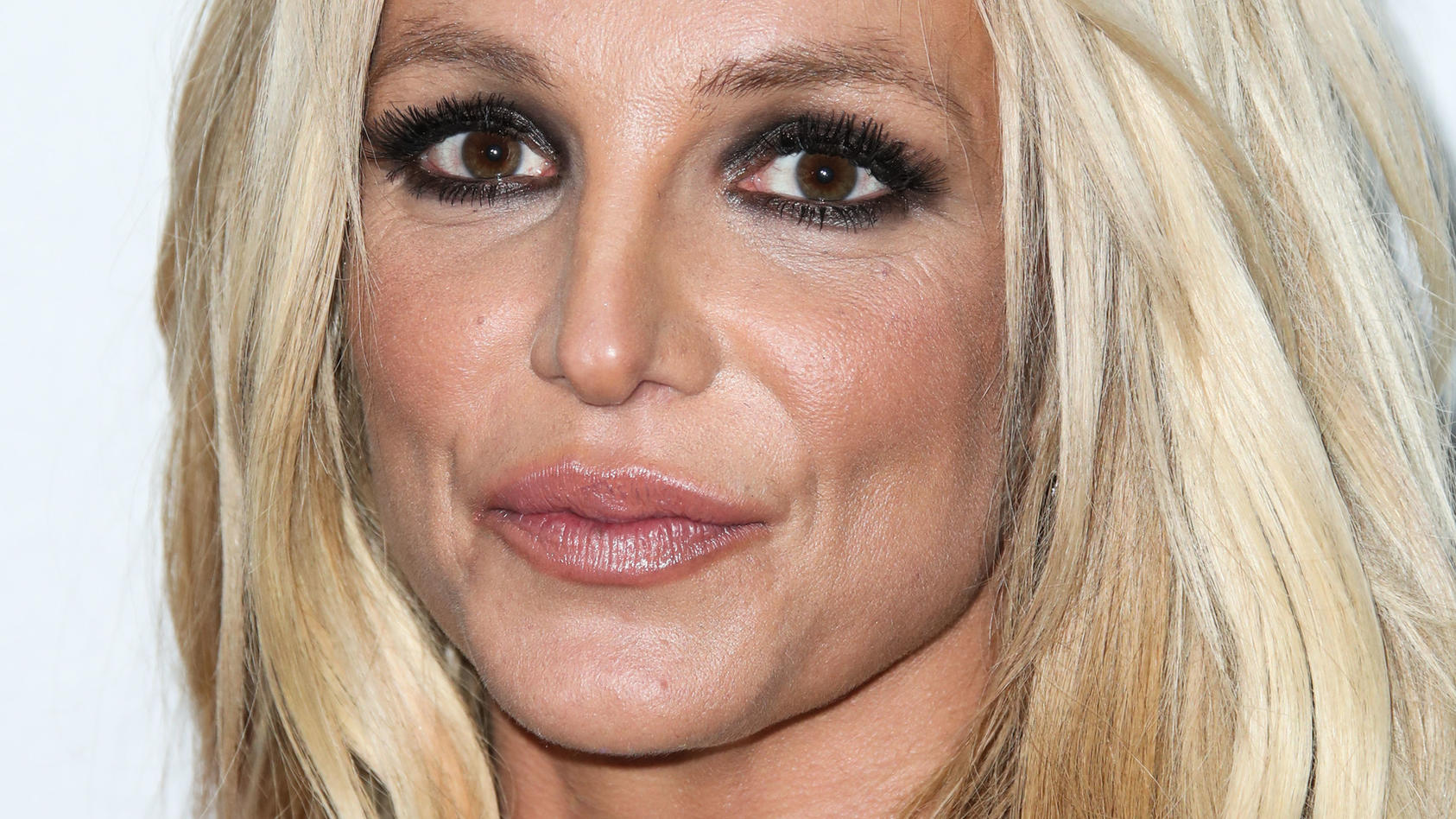 (FILE) Britney Spears responds to #FreeBritney conspiracy: 'All is well'. HOLLYWOOD, LOS ANGELES, CALIFORNIA, USA - FEBRUARY 25: Singer Britney Spears arrives at the 4th Annual Hollywood Beauty Awards held at Avalon Hollywood on February 25, 2018 in 