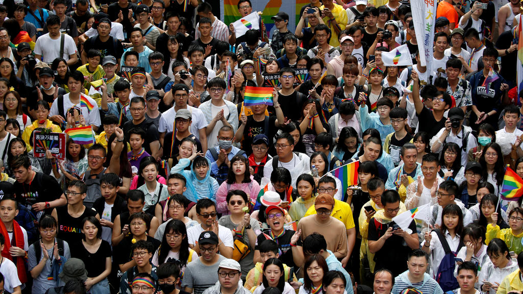 Same-sex marriage supporters hold umbrellas and rainbow flags as they take part in a rally during a parliament vote on three different draft bills of a same-sex marriage law, outside the Legislative Yuan in Taipei, Taiwan May 17, 2019. REUTERS/Tyrone