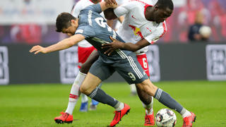 LEIPZIG, GERMANY - MAY 11: Robert Lewandowski of Bayern Munich competes for the ball with Ibrahima Konate of RB Leipzig during the Bundesliga match between RB Leipzig and FC Bayern Muenchen at Red Bull Arena on May 11, 2019 in Leipzig, Germany. (Photo by Alexander Hassenstein/Bongarts/Getty Images)
