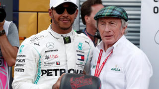 Formula One F1 - Monaco Grand Prix - Circuit de Monaco, Monte Carlo, Monaco - May 25, 2019   Mercedes' Lewis Hamilton is presented a tire by Jackie Stewart after qualifying in pole position   REUTERS/Benoit Tessier