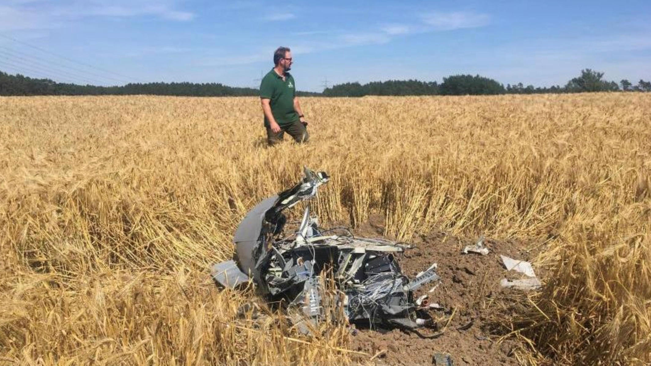 A forest official stands next to debris after two Eurofighter warplanes crashed after a mid-air collision near the village of Jabel in northeastern Germany June 24, 2019  REUTERS/Petra Konermann/Nordkurier NO RESALES. NO ARCHIVES     TPX IMAGES OF TH