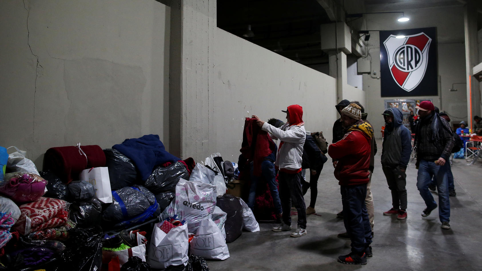 The homeless receive donations at River Plate stadium in Buenos Aires, Argentina July 3, 2019. REUTERS/Agustin Marcarian