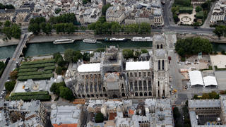 A view shows the damaged roof of Notre-Dame de Paris during restoration work, three months after a fire that devastated the cathedral in Paris, France, July 14, 2019. REUTERS/Philippe Wojazer