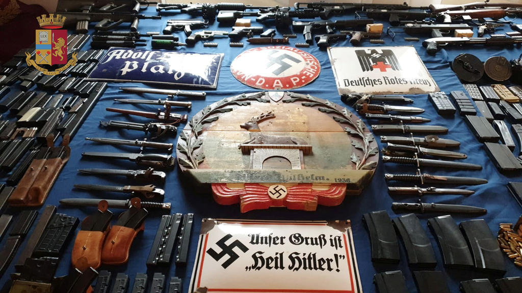Italian Police handout shows a large arsenal of weapons, including an air-to-air missile, that they say they seized in raids on neo-Nazi sympathisers, in Turin, Italy July 15, 2019. Polizia di Stato/Handout via REUTERS ATTENTION EDITORS - THIS IMAG