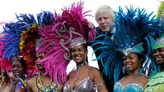 FILE PHOTO: London Mayor Boris Johnson joins dancers for a photocall to promote the Notting Hill Carnival at City Hall in London August 24, 2011.  REUTERS/Luke MacGregor/File Photo