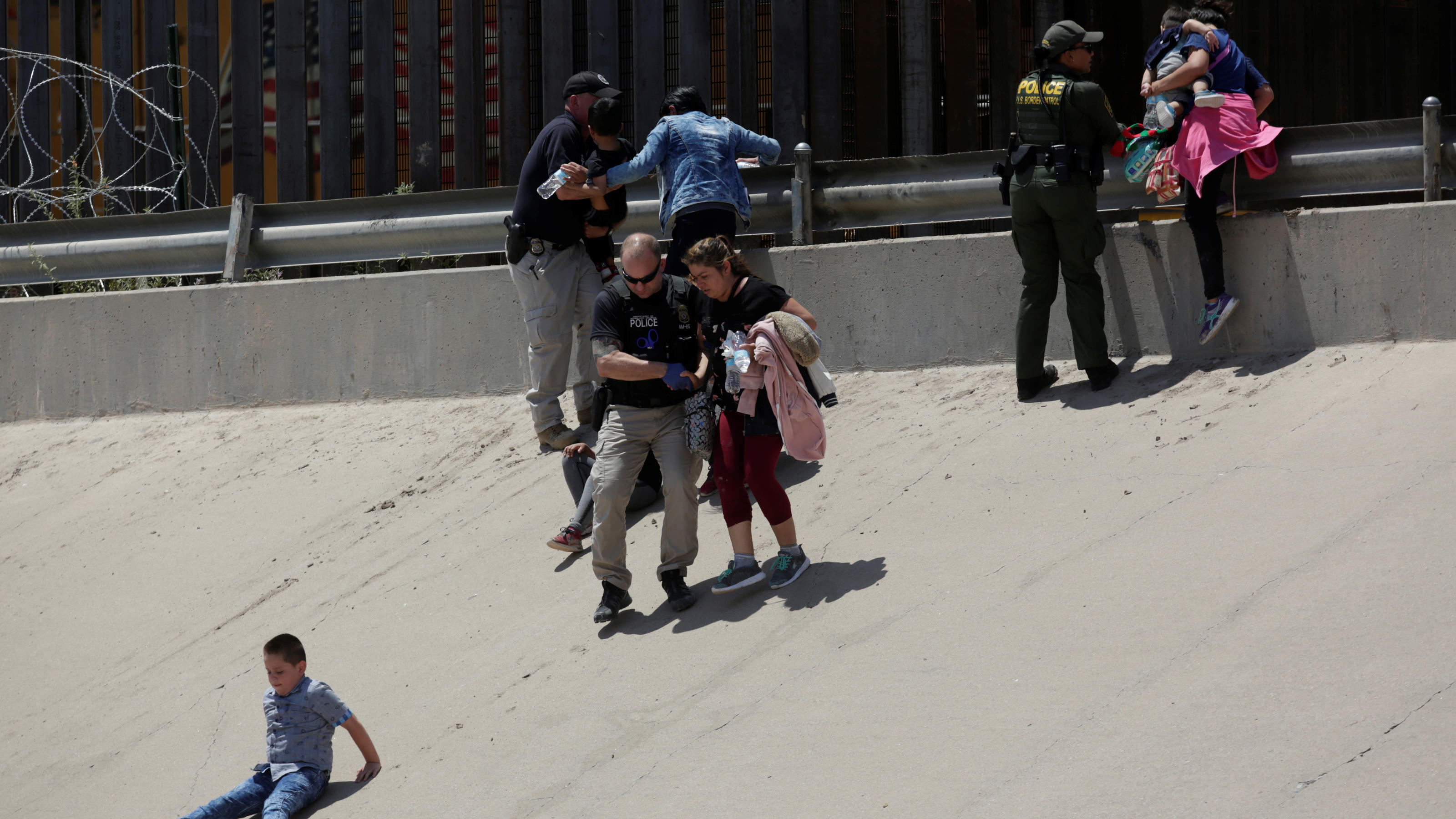 Migrant women with their children are detained by the U.S. Customs and Border Protection officials after crossing illegally into El Paso, Texas, U.S. and turning themselves in to request for asylum, as seen from Ciudad Juarez, Mexico July 13, 2019. R