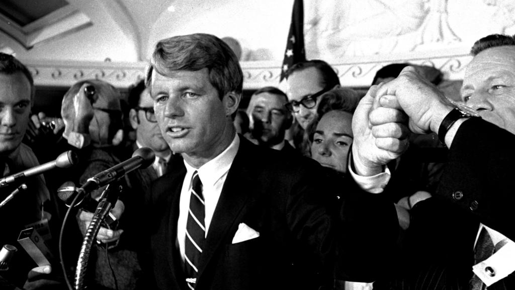 Sen. Robert F. Kennedy addresses a throng of supporters in the Ambassador Hotel in Los Angeles early in the morning of June 5, 1968, following his victory in the previous day's California primary election. A moment later he turned into a hotel kitch