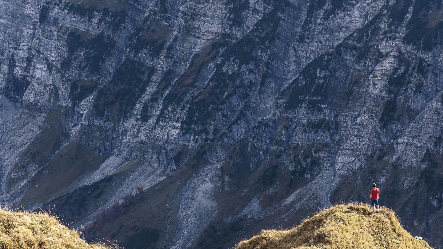 Austria Tyrol Hinterriss man standing on an edge in the Karwendel mountains between Torkopf and G