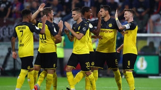 DUESSELDORF, GERMANY - AUGUST 09: Marco Reus of Borussia Dortmund (R) celebrates with teammates after scoring his team's first goal during the DFB Cup first round match between KFC Uerdingen and Borussia Dortmund at Merkur Spiel-Arena on August 09, 2019 in Duesseldorf, Germany. (Photo by Lars Baron/Bongarts/Getty Images)