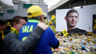 Soccer Football - Ligue 1 - FC Nantes v Nimes Olympique - The Stade de la Beaujoire - Louis Fonteneau, Nantes, France - February 10, 2019  General view of fans looking at tributes left outside the stadium in memory of Emiliano Sala  REUTERS/Stephane Mahe