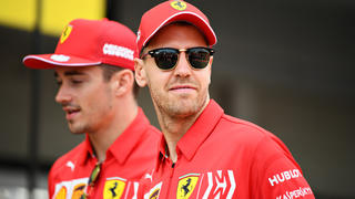 SUZUKA, JAPAN - OCTOBER 10: Sebastian Vettel of Germany and Ferrari and Charles Leclerc of Monaco and Ferrari walk in the Pitlane during previews ahead of the F1 Grand Prix of Japan at Suzuka Circuit on October 10, 2019 in Suzuka, Japan. (Photo by Clive Mason/Getty Images)