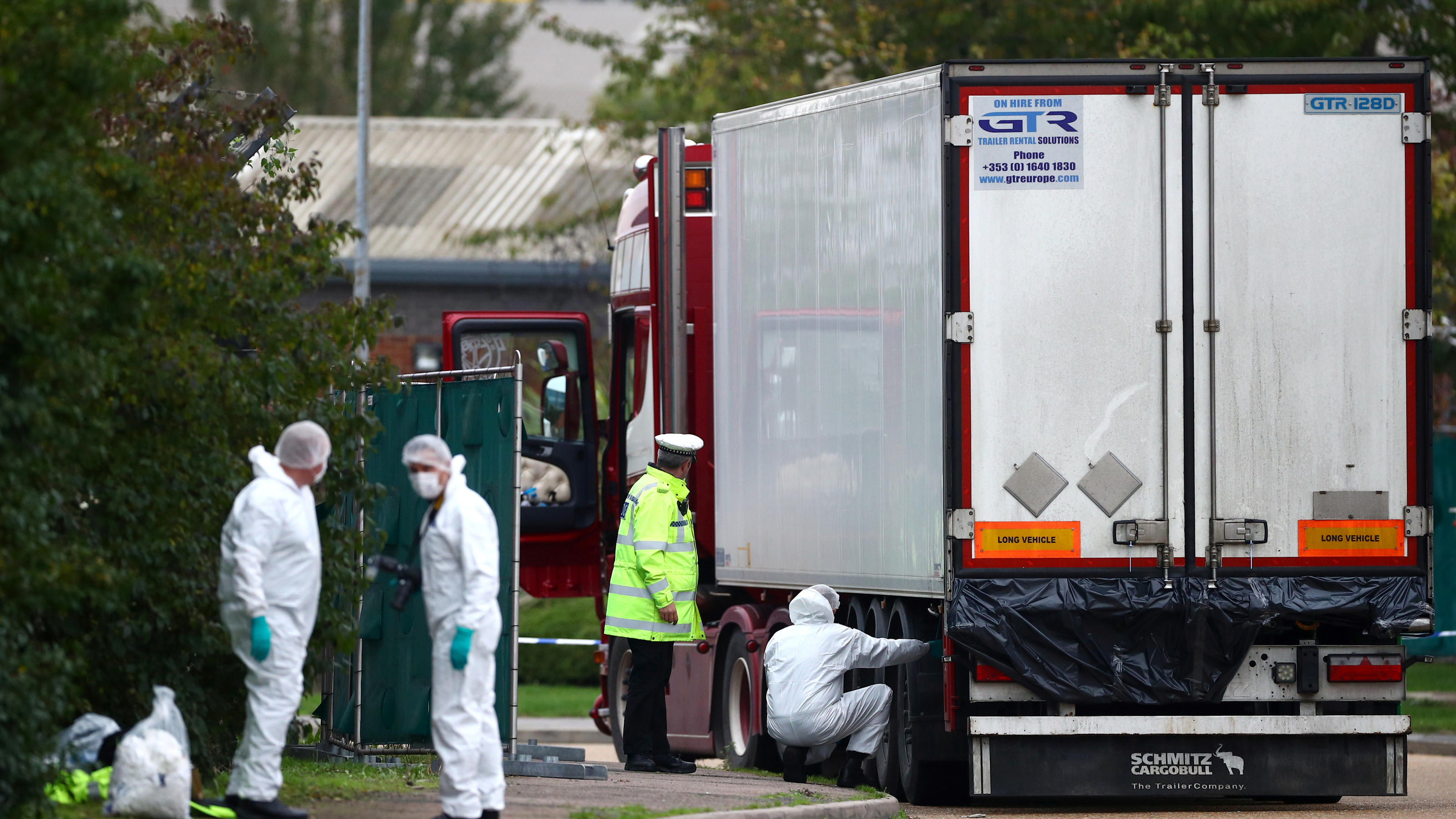 Police are seen at the scene where bodies were discovered in a lorry container, in Grays, Essex, Britain October 23, 2019.  REUTERS/Hannah McKay