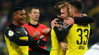 DORTMUND, GERMANY - OCTOBER 30: Julian Brandt of Borussia Dortmund celebrates after scoring his team's first goal with Mario Gotze and Julian Weigl during the DFB Cup second round match between Borussia Dortmund and Borussia Moenchengladbach at Signal Iduna Park on October 30, 2019 in Dortmund, Germany. (Photo by Lars Baron/Bongarts/Getty Images)