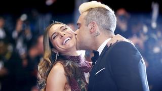 British singer Robbie Williams (R) kisses his wife Ayda Field as they arrive for the screening of the film 'The Sea of Trees' at the 68th Cannes Film Festival in Cannes, southeastern France, on May 16, 2015.   AFP PHOTO / VALERY HACHE        (Photo credit should read VALERY HACHE/AFP/Getty Images)