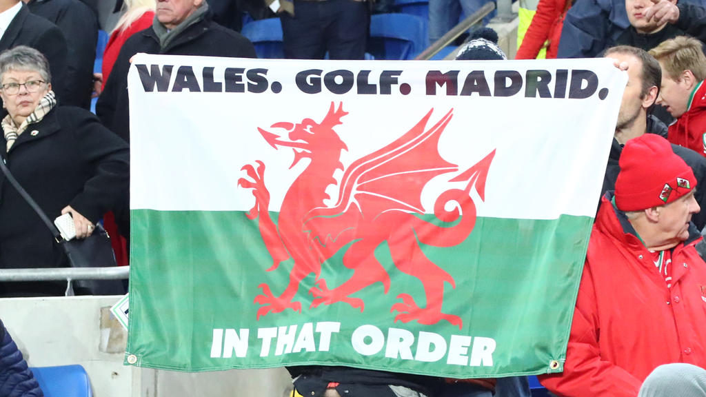 19th November 2019 Cardiff City Stadium, Cardiff, Glamorgan, Wales European Championships 2020 Qualifiers, Wales versus Hungary A Wales fan holds a flag that read Wales. Golf. Madrid. joking about recent media around Gareth Bale of Wales - Editorial 